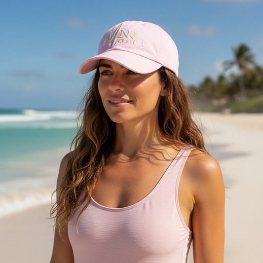 Woman wearing a pink cap and tank top on a beach